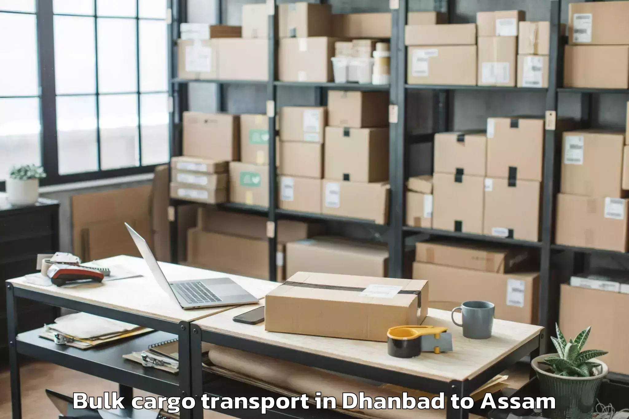 Book Dhanbad to Manikpur Bongaigaon Bulk Cargo Transport